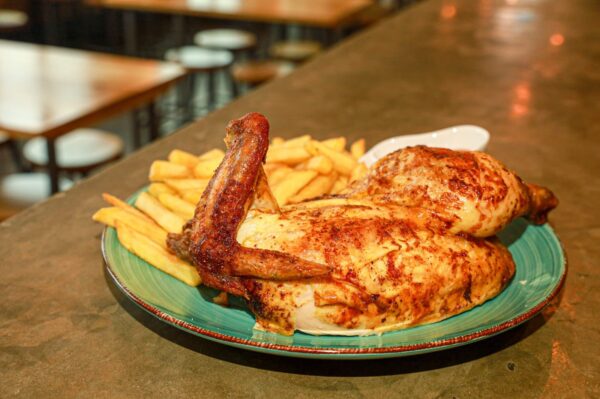 Half grill chicken with crispy fries in london
